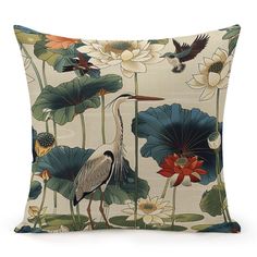 a decorative pillow with birds and flowers on the front, along with water lilies