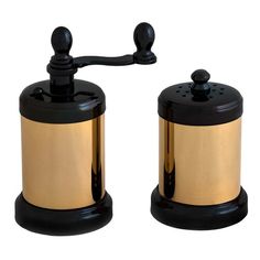 two black and gold salt and pepper shakers