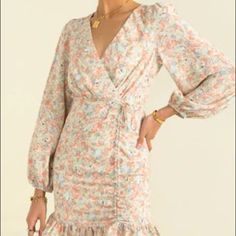 This Beautiful Floral Dress Is A Classic Sundae Muse Dress That Cinches Perfectly At The Waist. It Is In A Au Size 10 Which Fits A Us Size 4-6. In Perfect Condition, Never Worn. Spring Long Sleeve Floral Dress With Ruffle Hem, Spring Floral Dress With Ruffle Hem And Long Sleeves, Long Sleeve Floral Dress With Ruffle Hem For Summer, Spring V-neck Dress With Ruched Details, Spring V-neck Ruched Dress, Pink Floral Mini Dress With Ruffle Hem, Long Sleeve Ruched Beach Dress, Feminine Long Sleeve Dress For Day Out, Long Sleeve Ruched Summer Dress