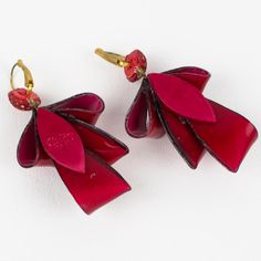 This is part of Chairish’s Costume Jewelry assortment.  Adorable dimensional dangling pierced earrings by Cilea Paris. Hand-made artisanal resin earrings featuring dimensional ribbons with textured patterns built together to form a powerful statement piece. Very nice vivid ruby red and silver colors. Marking underside of one earring: Cilea - Paris. For pierced ears. Measurements: 1.57 in wide (4 cm) x 2.94 in high (7.5 cm).  Please see the measurements noted above in the description for the best approximate dimensions. Red Chandelier Earrings As Gift, Handmade Red Earrings For Formal Occasions, Elegant Red Single Clip-on Earring, Red Pierced Earrings For Celebration, Red Single Earring For Formal Occasions, Red Drop Earrings For Evening, Red Clip-on Earrings For Evening, Unique Red Earrings For Formal Events, Unique Red Earrings For Formal Occasions