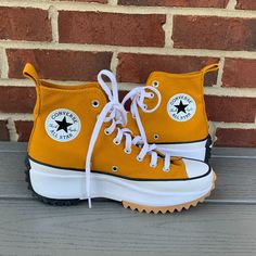 A Sculpted Platform And Serrated Sole Lend Style & Fun To These Iconic Converse Sneakers!! Features A 1 1/2" Heel, 1 1/4" Platform, 4 1/4" Shaft, Lace-Up Style, Removable Ortholite Insoles, Classic Star Detail On Patch And On Back Heel, Textile Upper, Textile And Synthetic Lining, And A Rubber Sole. Excellent New Condition, With Some Minor Marks/Dirt Throughout From Store Handling And No Dirt/Wear To Soles, As Pictured. In Hard To Find, Matches Everything, Gold!! Women's Size 8.5, Men's Size 7. Firm Price!! Trendy Converse Sneakers With Lug Sole, Yellow High-top Platform Sneakers, Yellow High-top Vulcanized Platform Sneakers, White Sole Canvas Shoes With Lug Sole, Converse Gold, All Stars Converse, Converse Sneakers, Hi Top, Womens Converse