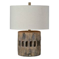 a wooden table lamp with a white shade