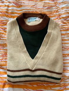 Vintage 1970s-era Keen Man knit tennis sweater - cream, with green and brown accents. "Men's" size medium.  Made in Korea, 100% acrylic.  Pre-owned but great condition!  Perfect for those preppy vibes! Retro Green Cotton Sweater, Retro Green Crew Neck Sweater, Retro Crew Neck Sweater Vest For Fall, Cream Retro Winter Sweater, Retro Fall Sweater, Retro Brown Sweater Vest For Winter, Retro White Sweater Vest For Fall, Retro Long Sleeve Cream Sweater, White Retro Sweater Vest For Fall