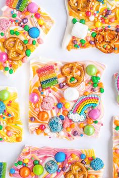 there are many different types of candies on the table with candy and pretzels