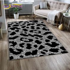 a black and white leopard print rug in a living room