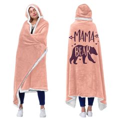 a woman wrapped in a pink blanket with the words mama bear printed on it and an image of a black bear