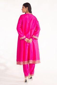 Magenta pink A-line kurta featuring zardozi hand embroidery on the neckline, sleeve and ghera hem. Paired with a straight pant. - Aza Fashions Pink Silk Palazzo Set With Intricate Embroidery, Pink Sherwani With Intricate Embroidery, Traditional Drape Pink Palazzo Set With Dabka, Pink Chanderi Sherwani With Zari Work, Bollywood Style Pink Kurta With Intricate Embroidery, Pink Chanderi Sherwani For Wedding, Pink Chanderi Sherwani With Resham Embroidery, Pink Embroidered Raw Silk Palazzo Set, Pink Anarkali Style Sherwani For Festive