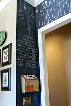 a chalkboard with christmas decorations on it