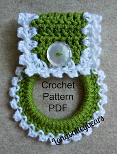 a crochet pattern with a button on the front and bottom, in green and white