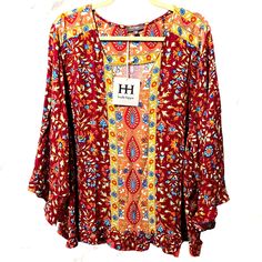 Nwt Hh Haute Hippie 3x Multi Floral Blouse W/ 3/4 Sleeves And Flutter Cuff By Haute Hippie High End Styling V-Neckline Beautiful Floral Prints Split Back With One Button Closure Flutter Cuff On 3/4 Sleeves Nwt Never Worn Size 3x (True To Size) 25” Length Pit To Pit Is 27” Dart To Dart Is 27.5” All Measurements Are Approximate. #2022 Please See Photos For Additional Details. Thank You For Visiting My Closet! It’s Means A Great Deal To Me. Questions? Leave Them In The Comments Below. Come Back And Multicolor Half-sleeve Blouse For Fall, Fall Rayon Tops With 3/4 Sleeves, Flowy Fall Blouse With 3/4 Sleeves, Rayon Tops With 3/4 Sleeves For Fall, Fall 3/4 Sleeve Rayon Tops, Red Floral Print Blouse With 3/4 Sleeves, Red Blouse With Floral Print And 3/4 Sleeve, Hippie Tops, Haute Hippie