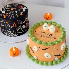 two cakes decorated with halloween decorations on top of a white table next to each other