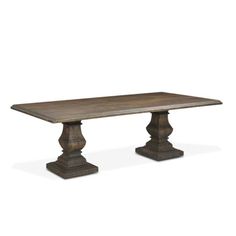 an old wooden table with two pedestals on each side and one leg raised up