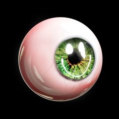 an eyeball with green and white designs on it's eyes is shown in the dark