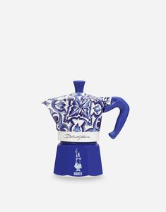 a blue and white coffee pot with an ornate design