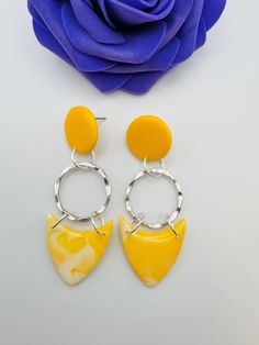 Sunshine Yellow Polymer Clay Earrings The pattern slab is Sunshine Yellow and White This combo is a mixed yellow and white Measurements at widest and longest point are 2.5cm and 6.5cm Check out all colour options in my etsy shop - https://purplerosebysarah.etsy.com Polymer clay is the perfect material for bold statement earrings as they are extremely lightweight so you can get the size but not the weight.  If you have never tried them before, you won't believe how comfortable they are. A 5 star Sunshine Yellow, Resin Coating, Gorgeous Earrings, Handmade Polymer Clay, Free Bag, Polymer Clay Earrings, Clay Earrings, Jewelry Care, Statement Earrings