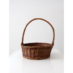 a wicker basket sitting on top of a white counter