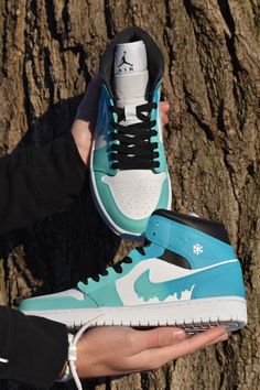 Custom made Jordan 1s. Starts with a gift box blue and fades into a turquoise with a dripping Nike symbol. Shoe represents melting ice. Prices are higher because the base shoes are a lot harder to get as the growing popularity of Jordan 1 mid increases. If you want the same design on a airforce 1 mid just select that option! The picture is just a mock-up and the real shoe will be the same colors as the Jordan 1 mid! Made with Angelus paint, paint is permanent. If you choose to receive a custom b Blue Low-top Sneakers For Gift, Airforce 1 Mid, Custom Made Jordans, Jordan Original, Air Jordan 1 Blue, Gift Box Blue, Custom Jordan, Jordan 1 Blue, Jordan 100