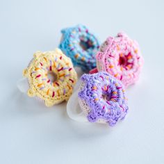 four crocheted donuts sitting on top of each other