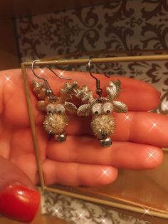 dangling reindeer earrings so cute for the holidays, the reindeer have little bells attached to them and they are gold tone. Festive Dangle Earrings With Matching Jewelry, Holiday Dangle Jewelry With Matching Earrings, Animal Design Dangle Earrings As Gift, Reindeer Antler Jewelry, Reindeer Earrings, Raindeer Earrings, Dangling Earrings, Christmas Reindeer, Reindeer