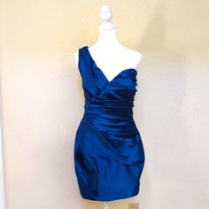 New Without Tags. Alexia Admor's Perfect Party Dresses Couldn't Have You Looking More Festive. This One Shoulder Style Will Gracefully Accent Your Figure. The Fitted Bodice Is Accented By Gathering Details And Builds Into The One Shoulder Focal Point. Size Small. The Fabric Has A Metallic Sheen. The Color Is More Like Cerulean Blue (See Second Photo And Photo Of Tag) Than Royal Blue. The Last Photos Depict The Fit Of The Dress Only. The Dress Is Blue, Not Red. Color: Cerulean Blue Mid-Weight Ace Blue Mini Dress With Ruched Bodice For Prom, Blue Satin Mini Dress For Wedding, Blue Ruched Mini Dress For Formal Occasions, Blue One-shoulder Dress With Ruched Bodice, Luxury Blue Asymmetrical Midi Dress, Blue One-shoulder Dress With Asymmetrical Neckline, Luxury Blue One-shoulder Mini Dress, Blue Fitted One-shoulder Dress With Asymmetrical Hem, Blue Satin Mini Dress With Ruched Detail