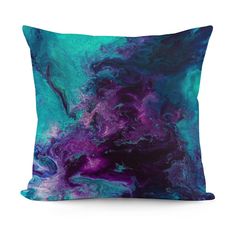 a blue and purple pillow on a white background