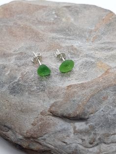 Green Lizard sea glass sterling silver stud earrings only 1 available  Found at The Lizard beach Green Sea Glass Jewelry, Minimalist Nickel-free Sea Glass Jewelry, Minimalist Nickel Free Sea Glass Jewelry, Round Sea Glass Jewelry Gift, Silver Sea Glass Earrings For Gift, Silver Hypoallergenic Sea Glass Earrings, Silver Hypoallergenic Earrings With Sea Glass, Hypoallergenic Silver Sea Glass Earrings, Silver Sea Glass Earrings For Beach