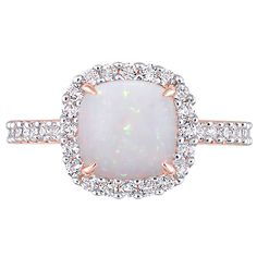 a white opal and diamond ring