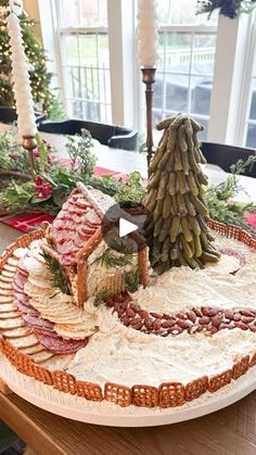 a platter that has food on it and a christmas tree in the center with lights