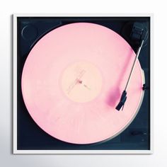 an old record player with pink vinyl on it