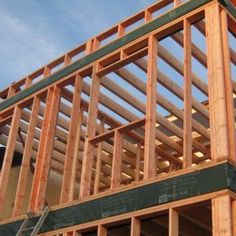 a house being built with wooden framing