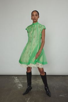 Green A-line Silk Dress, Green Silk A-line Dress, Green Silk Knee-length Dress, Green Knee-length Silk Dress, Designer Fitted Sleeveless Dress, Designer Short Sleeve Mini Dress For Evening, Designer Fitted Mini Dress, Designer Fitted Mini Dress With Short Sleeves, Designer Sleeveless Cocktail Dress