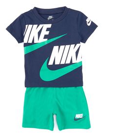 From Nike, this two-piece set features:Solid jersey t-shirt with crew necklineshort sleeves (one with "Nike" logo and "Swoosh" design trademark)wraparound "Nike" and "Swoosh" design trademark designs pullover constructionSolid shorts with elastic waist pull-on construction"Nike" logo and "Swoosh" design trademark on one legJersey t-shirt of cotton/polyester; shorts of tricot polyesterMac Green Cotton Sporty Sets, Green Cotton Crew Neck Sets, Summer Green Sets With Graphic Print, Green Summer Set With Graphic Print, Green Graphic Print Summer Sets, Green Short Sleeve Sets With Letter Print, Green Short Sleeve Set With Letter Print, Nike Short Sleeve Sports Sets, Nike Sports Sets With Short Sleeve