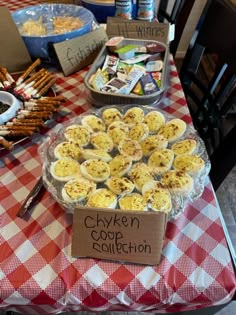 a table topped with lots of food and plates filled with devil's creme eggs