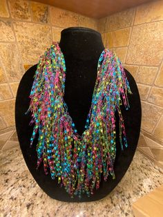 Scarf/Necklace  Colors:  Jasmine - beautiful "bright" shades of blues, pinks, greens & yellows. Check out my shop for many other colors.  If don't see a color, please ask🙂 Handmade, lightweight - made from ladder yarn (nylon & lurex) Approximately 68" in length. Can be worn as an Infinity (double loop), Pull-through  or just let it hang. Perfect item  to dress up any outfit. Unique Multicolor Summer Necklaces, Funky Multicolor Festival Necklaces, Multicolor Multi-strand Necklace For Party, Funky Multicolor Beaded Necklace, Multicolor Fun Beaded Necklaces For Party, Fun Multicolor Beaded Necklaces For Parties, Fun Multicolor Beaded Necklace For Parties, Fun Multicolor Beaded Party Necklaces, Ladder Yarn