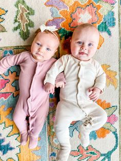 Fitted Organic Cotton Onesie For Playtime, Soft Fitted Cotton Onesie, Cream Cotton Onesie For Playtime, Cream Cotton Playtime Onesie, Cream Long Sleeve Cotton Jumpsuit, Soft Fitted Onesie For Playtime, Cream Long Sleeve Onesie For Playtime, Soft Fitted Onesie For Loungewear, Fitted Organic Cotton Long Sleeve Onesie