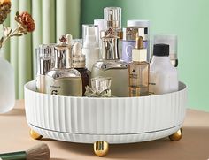 a white tray filled with lots of different types of beauty products on top of a table