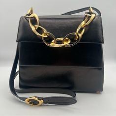 Salvatore Ferragamo 100% Authentic Sleek Soft Leather Black 2 Way Bag. Gold Chunky Hardware, Original Removable Black Leather Crossbody Strap. Interior Gold Lined With One Zip Pocket. Classic Timeless Piece! Measurements 8” X 8.5” X 3” Questions, Please Ask Below In The Comments! Excellent Pre Loved Condition Gold Interior, Gold Line, Timeless Classic, Salvatore Ferragamo, Leather Crossbody, Timeless Pieces, Soft Leather, Zip Pockets, Black Leather