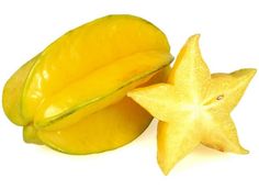 a star fruit cut in half and placed next to it