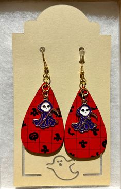 🎃 Get spooky chic this Halloween with our laser-cut teardrop earrings!  THIS LISTING IS FOR THE RED TEAR DROP DESIGN WITH CHARMS.  FOR OTHER OPTIONS, CHECK OUT THESE LISTINGS! BLACK TEAR DROP DESIGN WITH CHARMS: RED GHOST DESIGN WITH CHARMS: BLACK GHOST DESIGN WITH CHARMS: 👻 PRODUCT DETAILS 👻  - Double-side printed MDF for a 360-degree pop of festive flair. - Designed with a lightweight fish hook and clear back stopper. - Mini charm to add that extra touch of whimsy.  - Each pair comes nestled on padding inside a box with a clear lid, and sealed with various festive washi tape. - Approximately 2.75x1.2" 🕸️ Don't wait--treat yourself to these fab Halloween earrings before they disappear like a ghost! 👻 As a small business owner, I truly appreciate your support and patronage.  My goal i Themed Red Earrings, Fun Red Jewelry For Halloween, Red Fun Halloween Jewelry, Fun Red Halloween Jewelry, Red Pierced Halloween Earrings, Red Earrings As Halloween Gift, Red Earrings For Halloween Gift, Spooky Red Halloween Jewelry, Red Pierced Earrings For Halloween