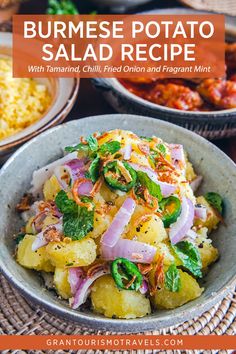 a bowl filled with potatoes and onions on top of a table