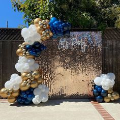 an arch made out of balloons and streamers