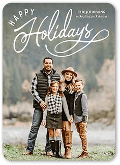 a holiday card with the words happy holidays written on it and two family members standing in front of a river