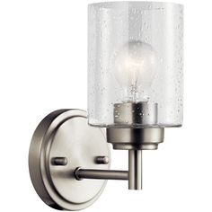 a wall light with a glass shade on the top and bottom part of it's arm