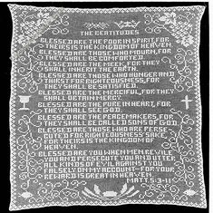 a white doily with words written in black and white on the bottom, along with an ornate border