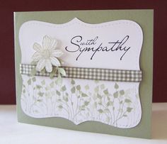 a card with a flower on the front and some writing on the back that says sympathy