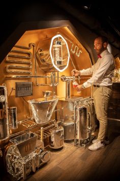 a man is standing in front of some metal items