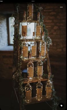 a wooden stand with bottles on it that says dreamy seating plan for all in the detail