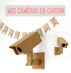 an image of a cardboard box with a cat house on the top and bunting