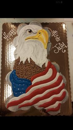 an eagle with the american flag on it's back is made out of frosting