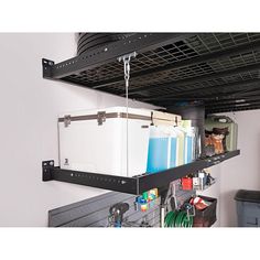 an overhead storage rack with various items on it